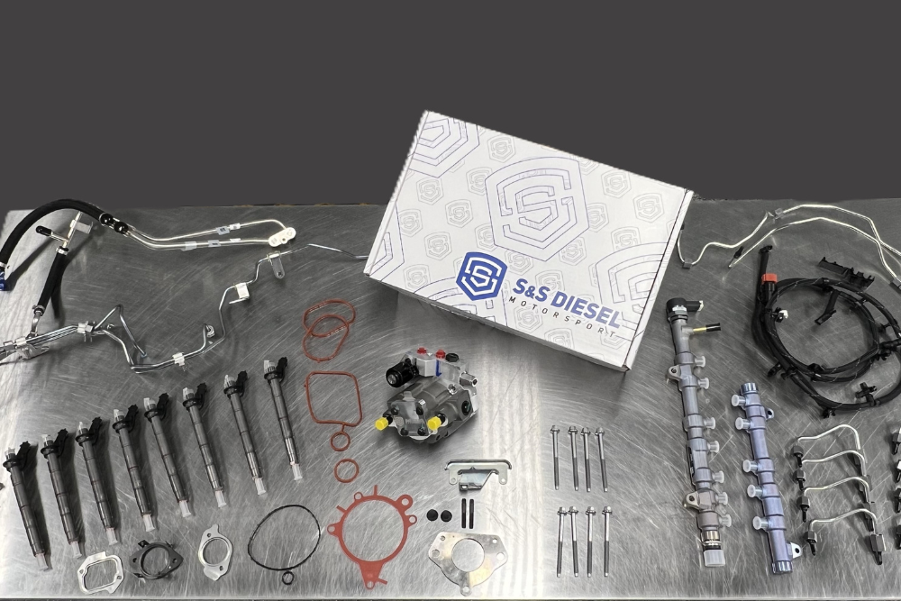 Fuel System Upgrades. Diesel Repair Shop in Bremen,OH. Unlimited Diesel Performance. Image of S&S Diesel DCR Conversion Kit parts laid out, showcasing the components used to replace CP4 pumps and improve reliability for 6.7 Powerstroke engines.
